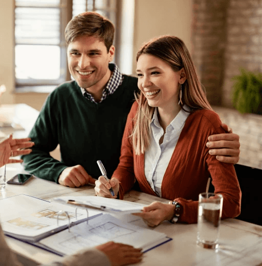 Couple signing documents